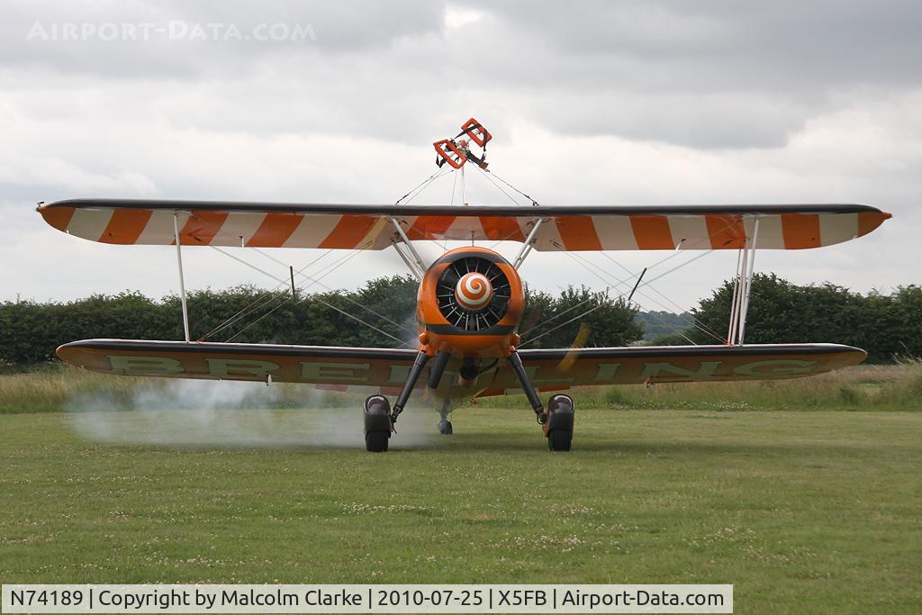 N74189, 1941 Boeing PT-17/R985 Kaydet (A75N1) C/N 75-717, A smokey start-up for a Boeing PT-17 Kaydet at Fishburn Airfield in July 2010.