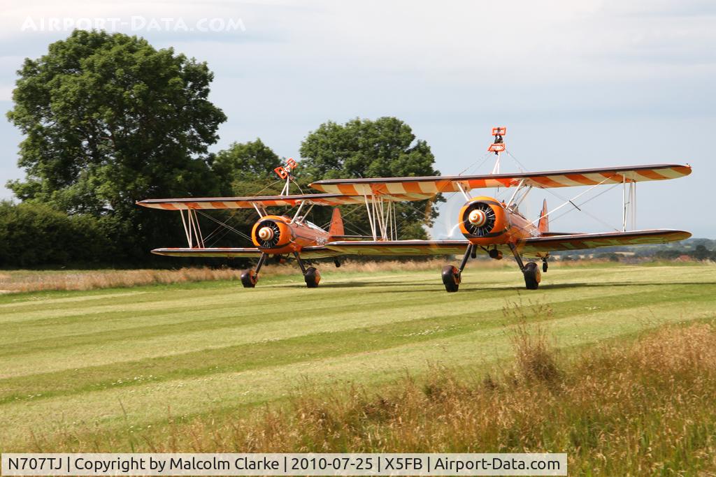 N707TJ, 1943 Boeing A75N1(PT17) C/N 75-950, Taking off, together with sister ship N74189, from Fishburn Airfield for a wing walking performance at the 2010 Sunderland Air Show. Sponsored by The Breitling Watch Co for 2010.