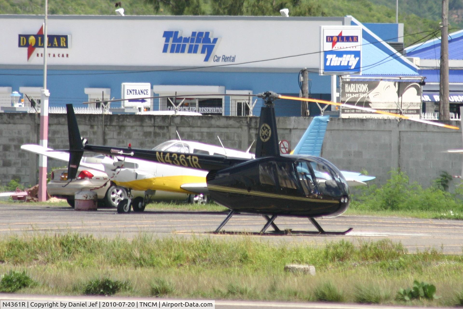 N4361R, Robinson R44 II C/N 12816, N4361R park at the helipad at TNCM