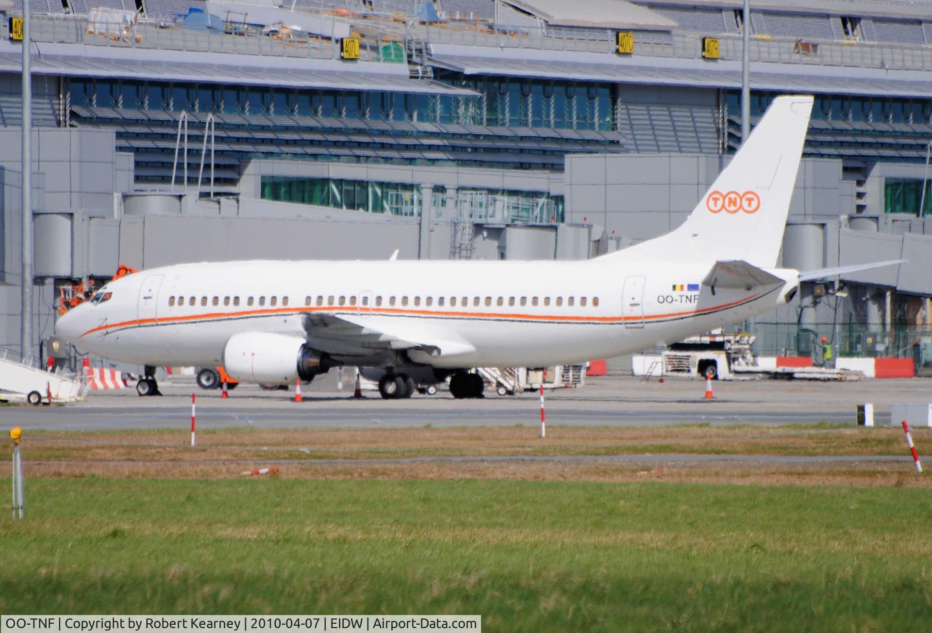 OO-TNF, 1988 Boeing 737-3Q8(QC) C/N 24131, TNT parked along the new pier of T2