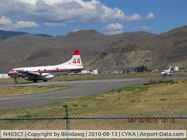 N403CT, 2006 Raytheon Hawker 850XP C/N 258818, ...waiting for a Conair / Convair 580 Air Tanker to depart...forest fires in the area.