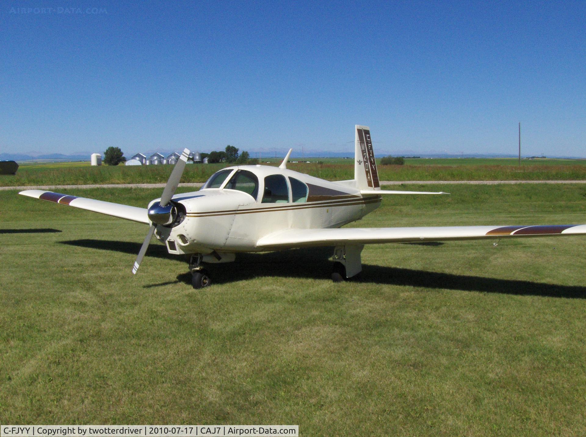 C-FJYY, 1959 Mooney M20A C/N 1459, On the grass