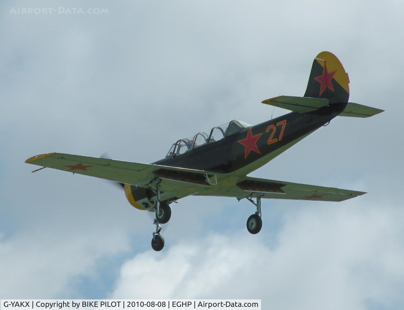 G-YAKX, 1991 Yakovlev (Aerostar) Yak-52 C/N 9111307, KILO X-RAY ON A GO AROUND. POPHAM AUSTER FLY-IN 2010-08-08.