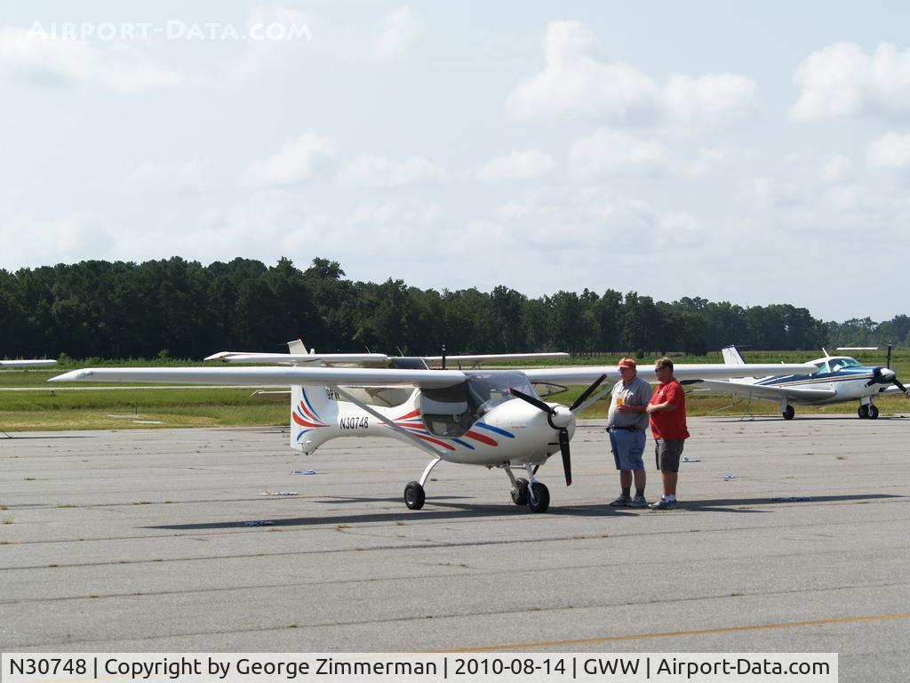 N30748, 2006 Fantasy Air Allegro 2000 C/N 06-223, Pilot discusses aircraft with Goldsboro-Wayne employee