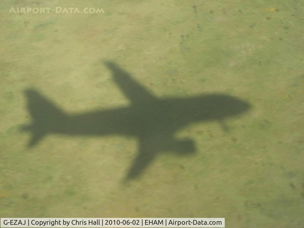 G-EZAJ, 2006 Airbus A319-111 C/N 2742, shadow of G-EZAJ as we approach Amsterdam Schiphol