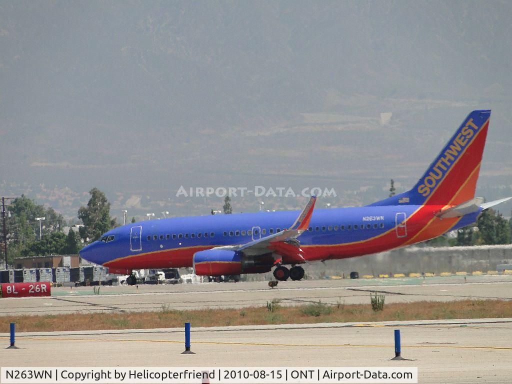 N263WN, 2007 Boeing 737-7H4 C/N 32520, Completing a roll out on runway 26R and preparing to taxi back to Southwest Terminal