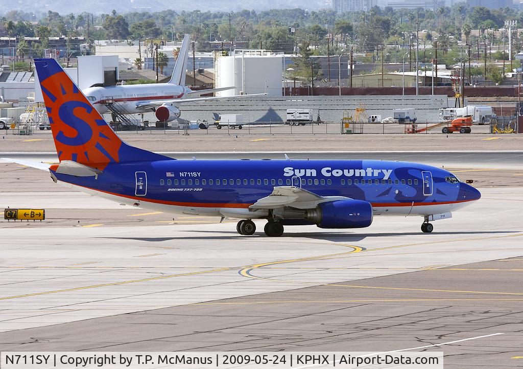 N711SY, 2002 Boeing 737-73V C/N 30245, Sun Country  B-737 taxiing to the active rwy 26 for departure from PHX.