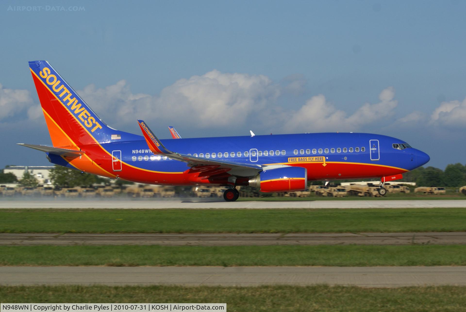 N948WN, 2010 Boeing 737-7H4 C/N 36662, N948WN Leaving Oshkosh AirVenture 2010
