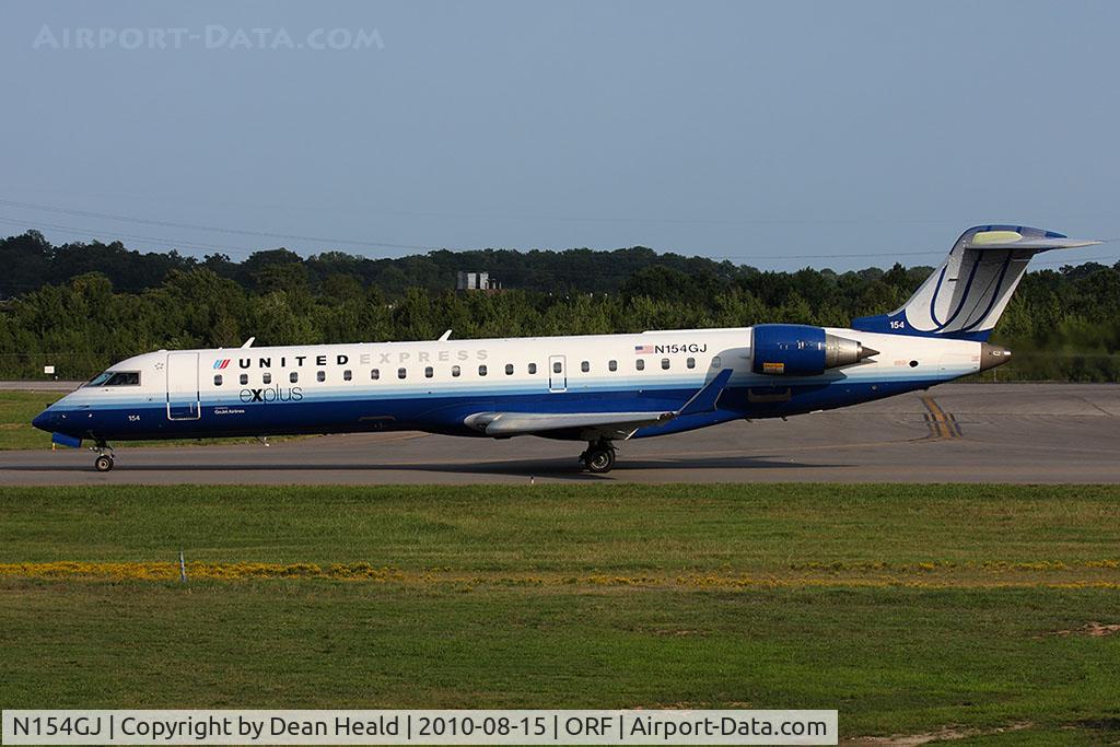 N154GJ, 2005 Bombardier CRJ-702 (CL-600-2C10) Regional Jet C/N 10224, United Express (GoJet Airlines) N154GJ (FLT GJS7381) on taxiway Charlie taxiing to RWY 23 for departure to Chicago O'Hare Int'l (KORD).