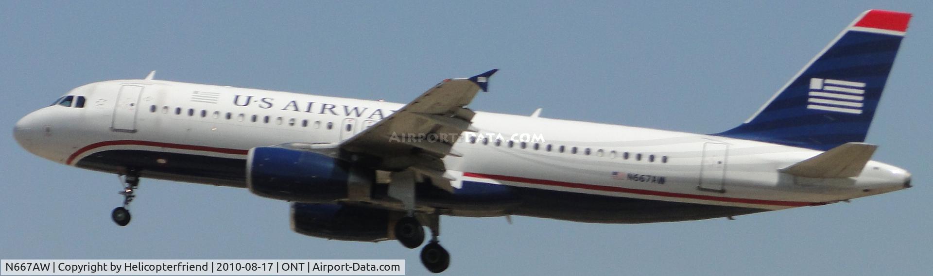 N667AW, 2002 Airbus A320-232 C/N 1710, Nose up during final to runway 26R