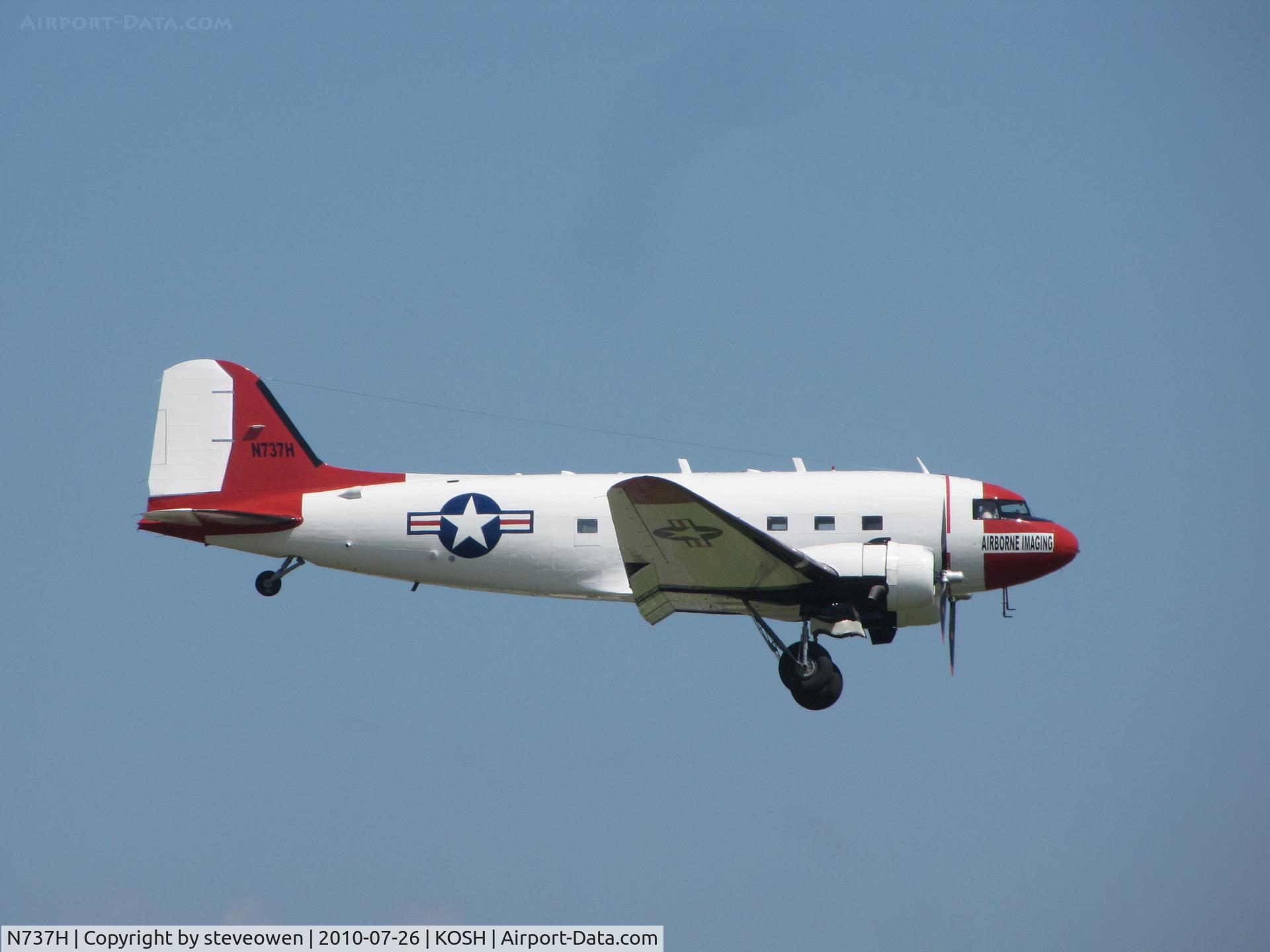 N737H, 1942 Douglas R4D-1 (DC-3C) C/N 6062, Toucjhing down at Oshkosh 2010 during mass arrivals