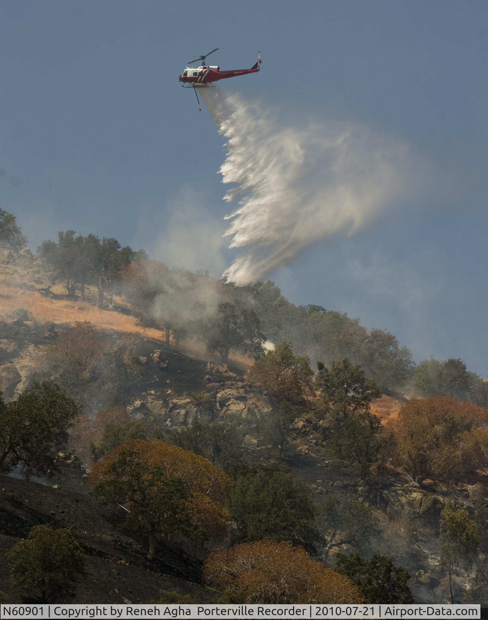 N60901, 1970 Bell UH-1H Iroquois C/N 12537, Photo July 2010, taken on the Curve Fire between Springville and Porterville CA.  Taken by Reneh Agha of the Porterville Recorder.