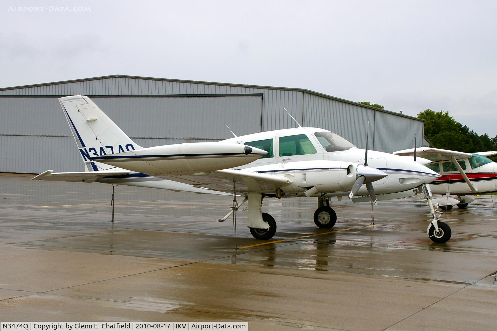 N3474Q, 1966 Cessna 320E Executive Skyknight C/N 320E-0074, On a rainy ramp