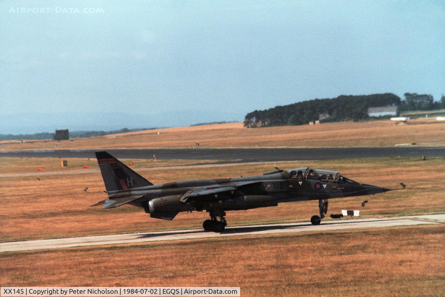 XX145, 1974 Sepecat Jaguar T.2 C/N B.10, Jaguar T.2 of 226 Operational Conversion Unit joining the active runway at RAF Lossiemouth in the Summer of 1984, ten years after first arriving there with the Unit