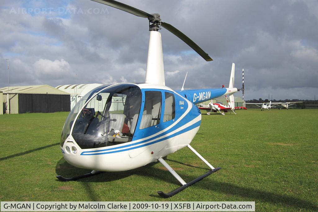 G-MGAN, 1999 Robinson R44 C/N 0588, Robinson R44 Astro at Fishburn Airfield in October 2009.