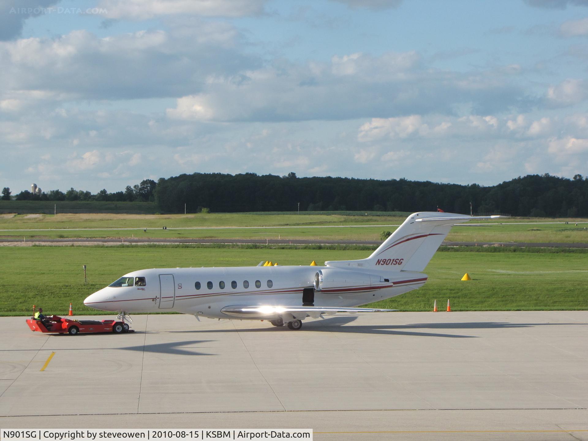 N901SG, 2009 Hawker Beechcraft 4000 C/N RC-29, being tugged into place at KSBM