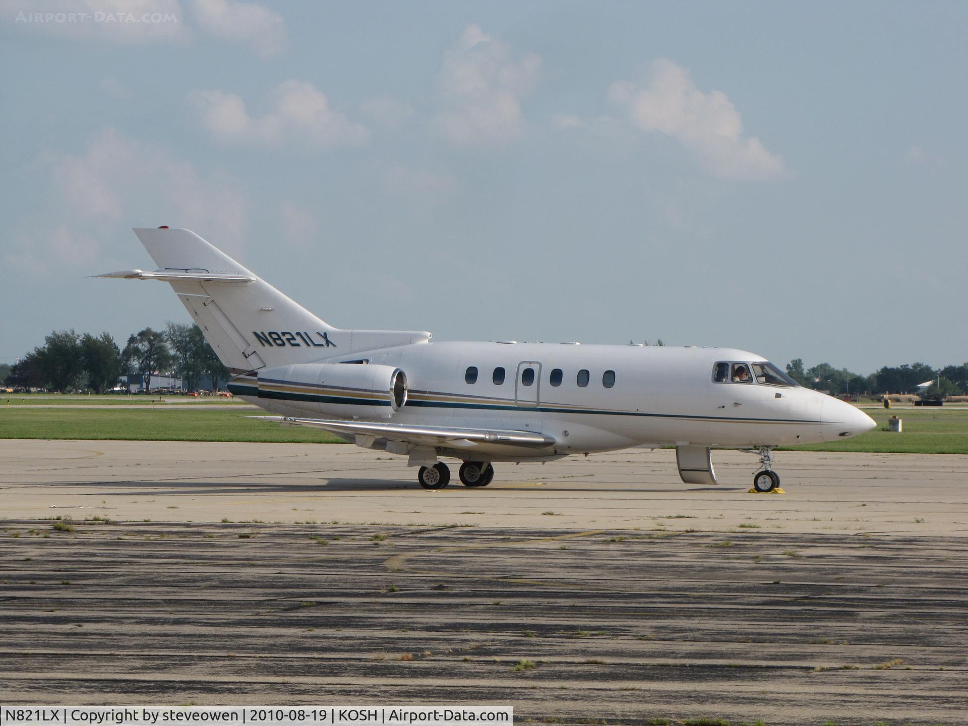 N821LX, 1999 Raytheon Hawker 800XP C/N 258406, Basler ramp at KOSH