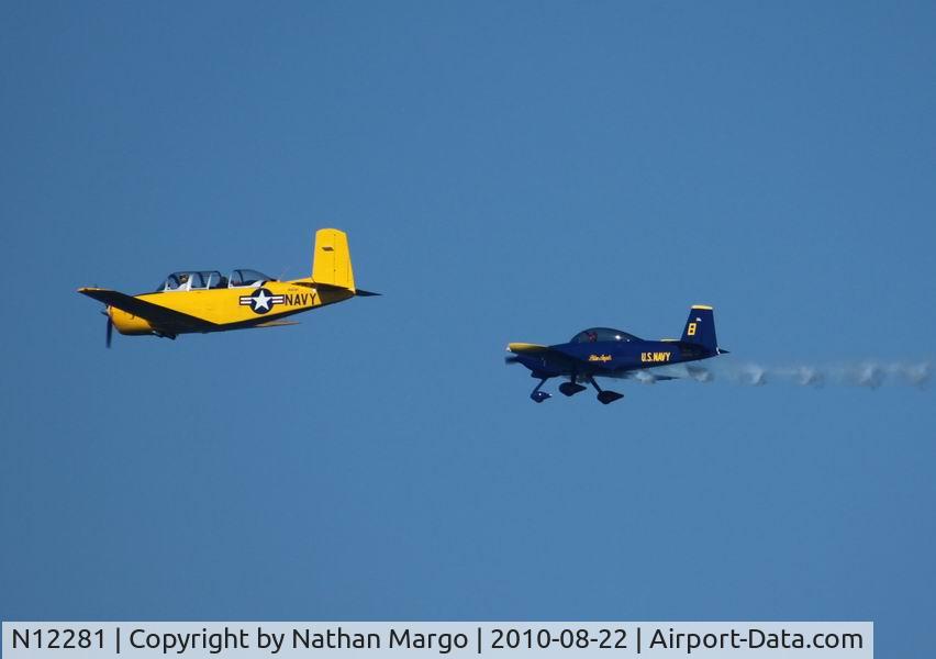N12281, 1955 Beech T-34A (A45) Mentor Mentor C/N G-293, Seen escorting the slowest Blue Angel over the Ocean Beach Pier, San Diego, California.