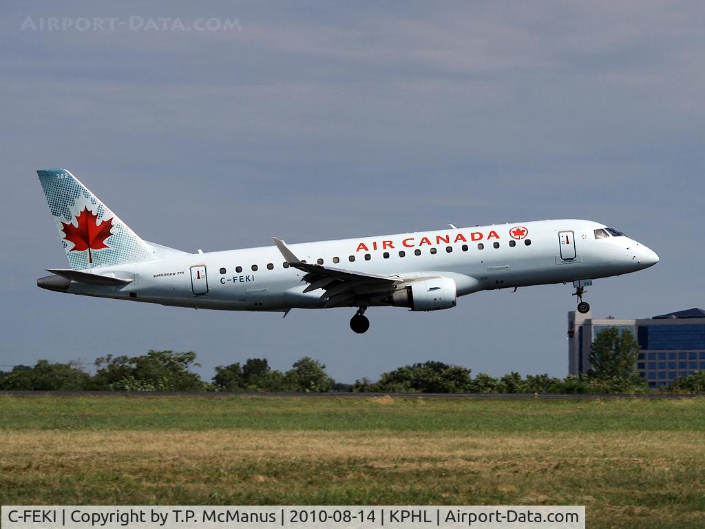 C-FEKI, 2005 Embraer 175SU (ERJ-170-200SU) C/N 17000103, Air Canada RJ touching down on 9-R at PHL.