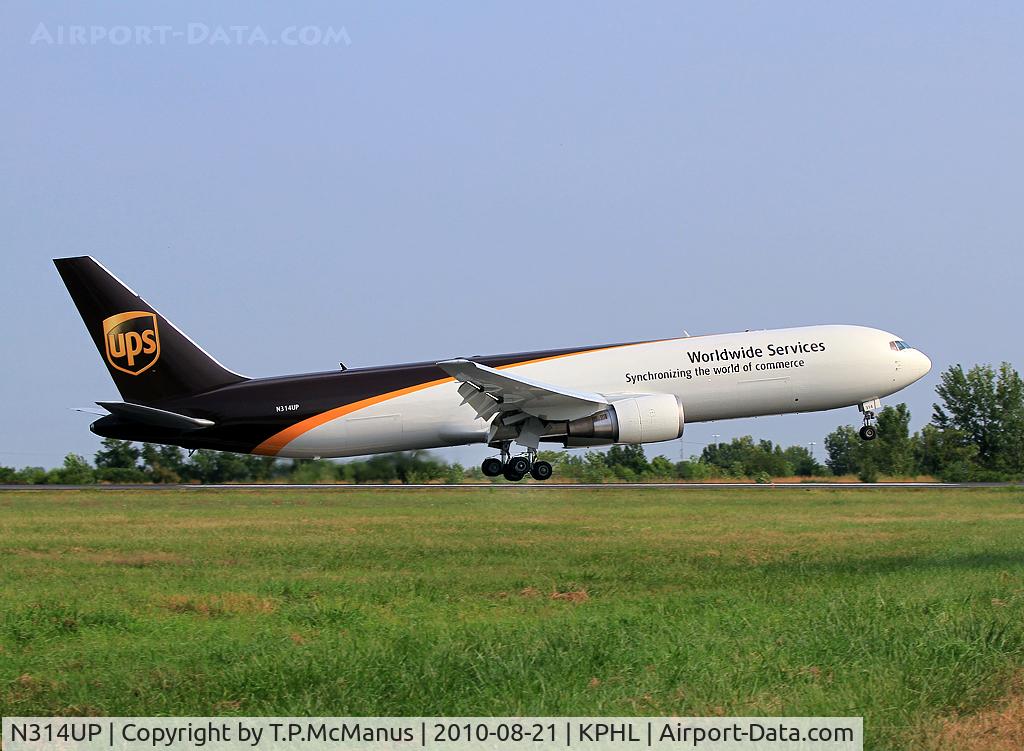 N314UP, 1996 Boeing 767-34AF C/N 27742, UPS B767 'Heavy' touching down on 9R at PHL.