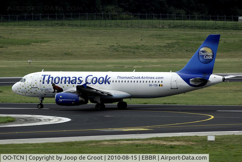 OO-TCN, 1993 Airbus A320-232 C/N 425, with one tennis player and many tennis balls on the front fuselage.