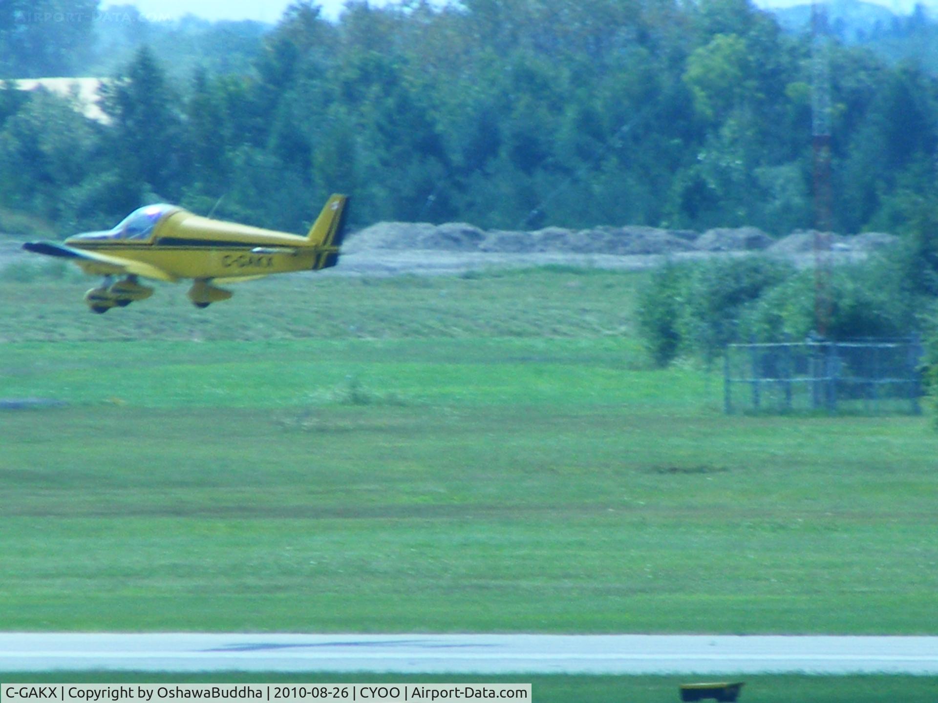 C-GAKX, 1979 Zenair Zenith CH-200 C/N A-53, Not the clearest i admit.  But it's hard to get a good pic when you're a few hundred yards away 3 stories up overlooking the airport....lol