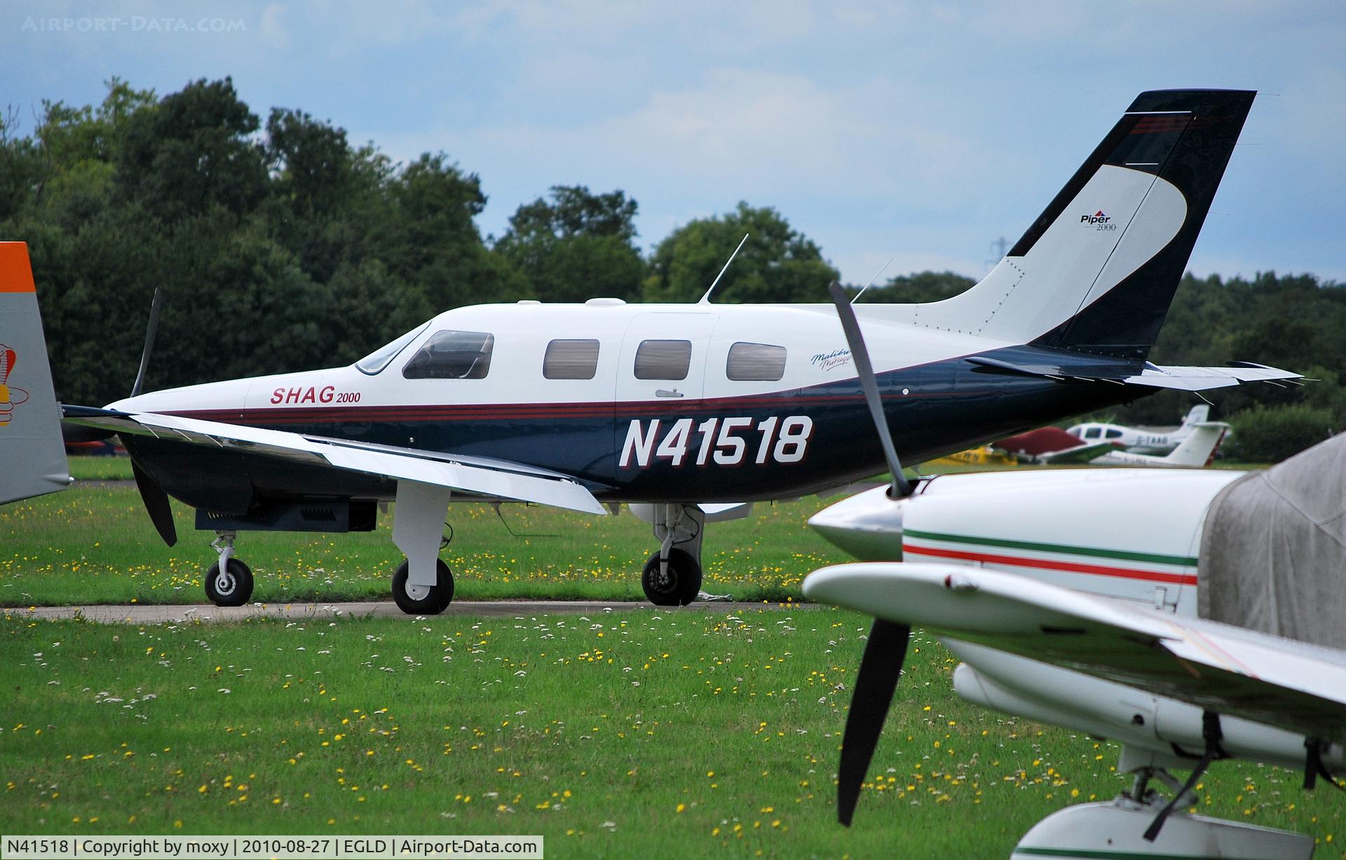 N41518, 2000 Piper PA-46-350P Malibu Mirage C/N 46-36302, Piper PA-46-350P Malibu at Denham. The significance of 'SHAG 2000' just forward of the cockpit is unknown. If it's a suggestion, I've some way to go.