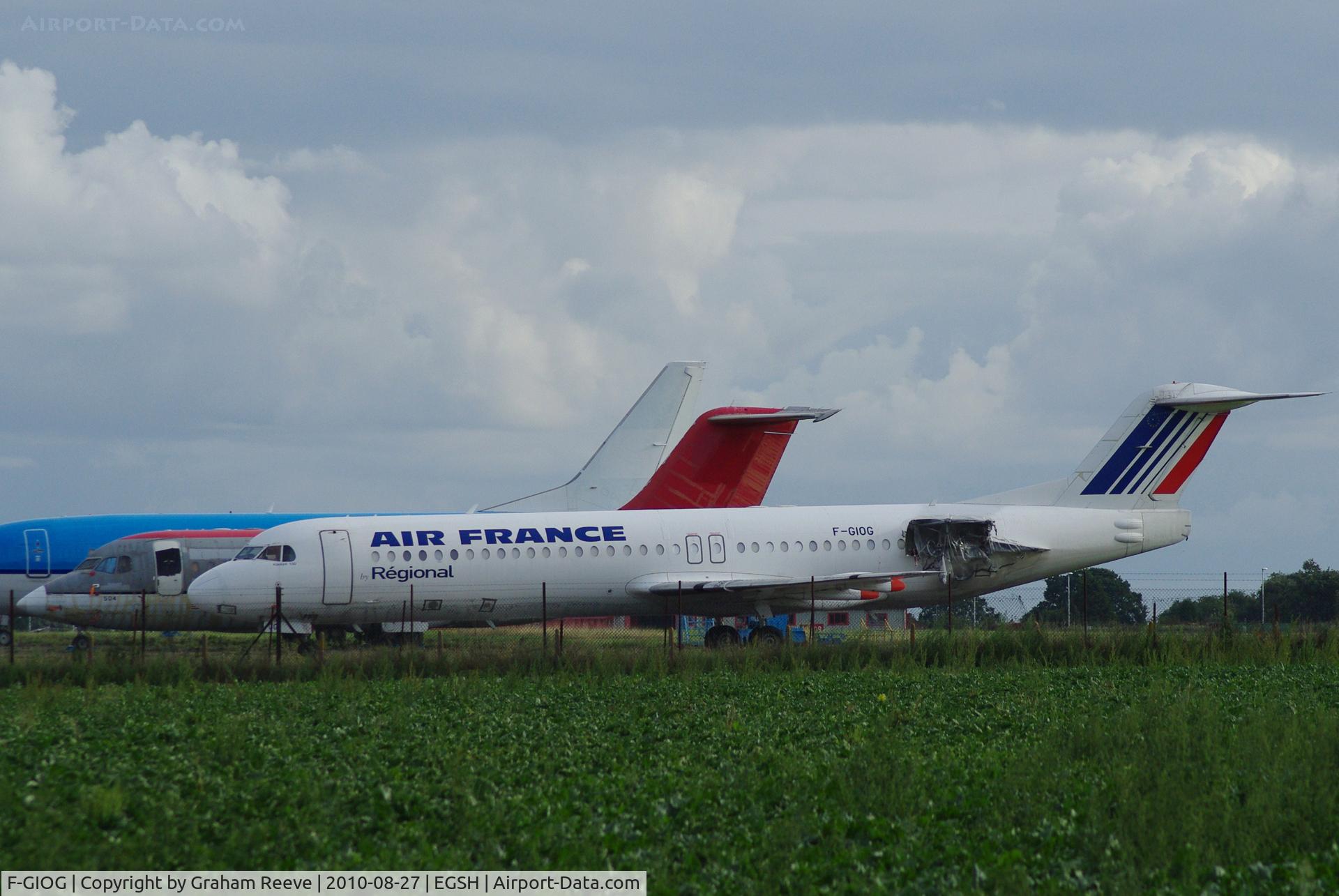 F-GIOG, 1991 Fokker 100 (F-28-0100) C/N 11364, Parked at Norwich minus engines. BAe 146 and Boeing 737 in back ground.