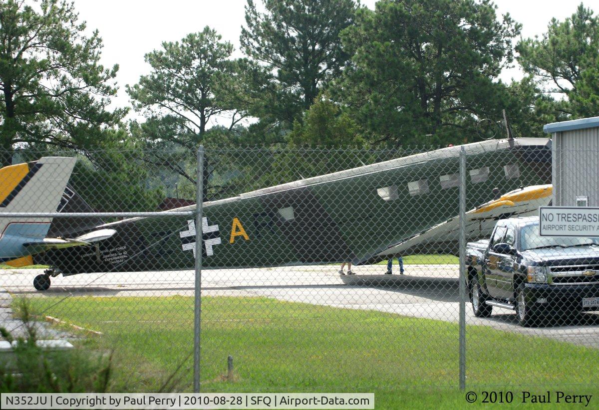 N352JU, 1941 Junkers (CASA) 352L (Ju-52) C/N 67, You never know what you'll see behind a fence