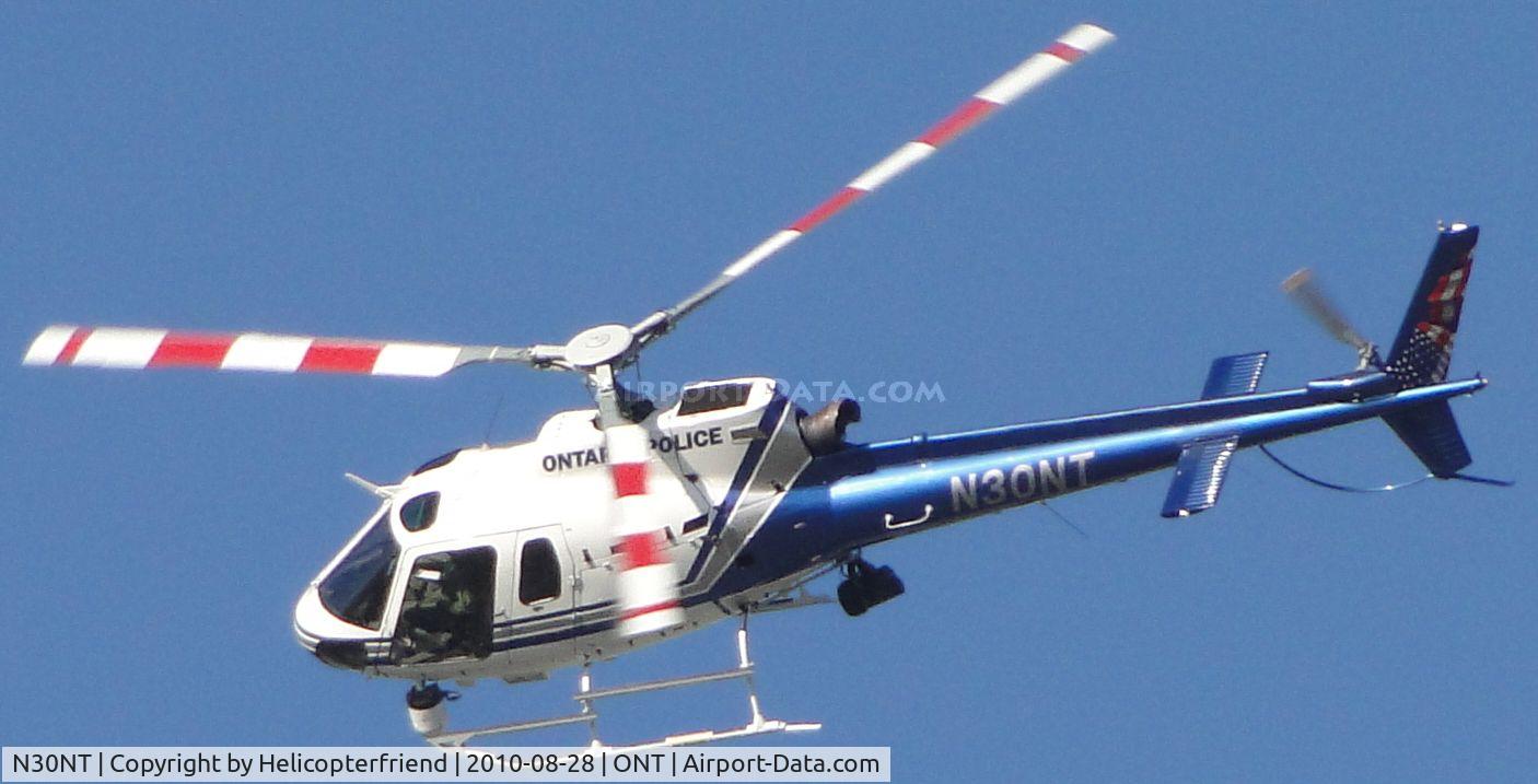N30NT, 2007 Eurocopter AS-350B-2 Ecureuil C/N 4352, Orbiting a call where observer has his door off because of the great weather and is assisting a Police Car on the ground, north of Ontario Airspace