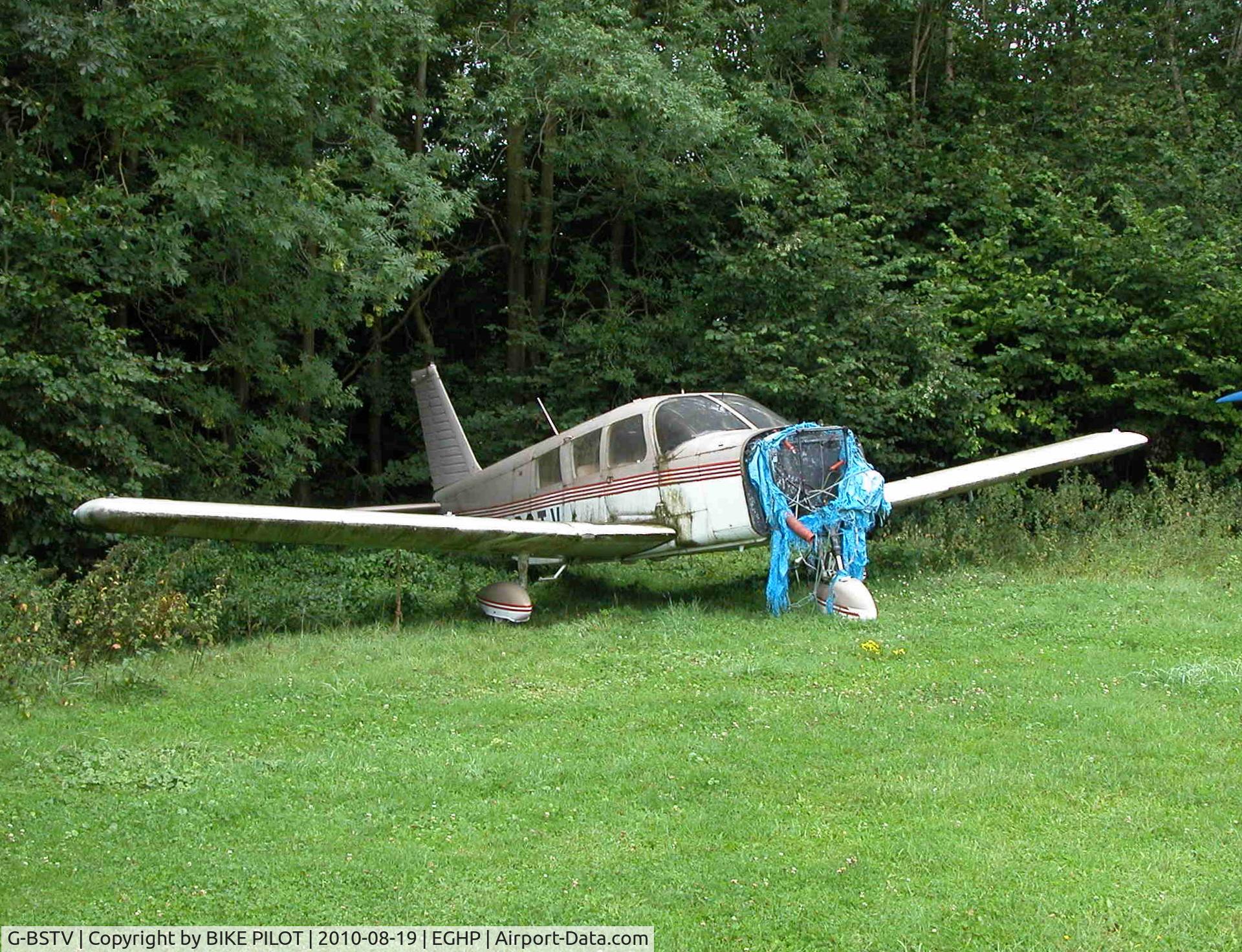 G-BSTV, 1967 Piper PA-32-300 Cherokee Six Cherokee Six C/N 32-40378, Longterm derilict Cherokee Six now moved under the trees.