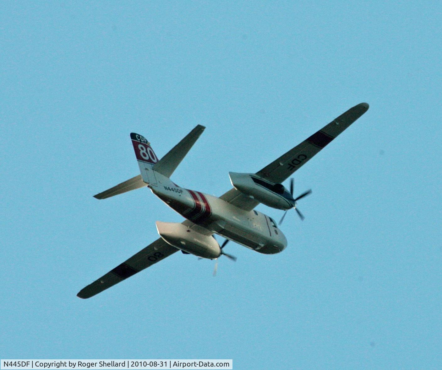 N445DF, Grumman S2F-1 Tracker C/N 152, One of two circling a fire in Soquel CA as it passed over our house late afternoon sun was a problem so had to let it pass over  hence rear shot