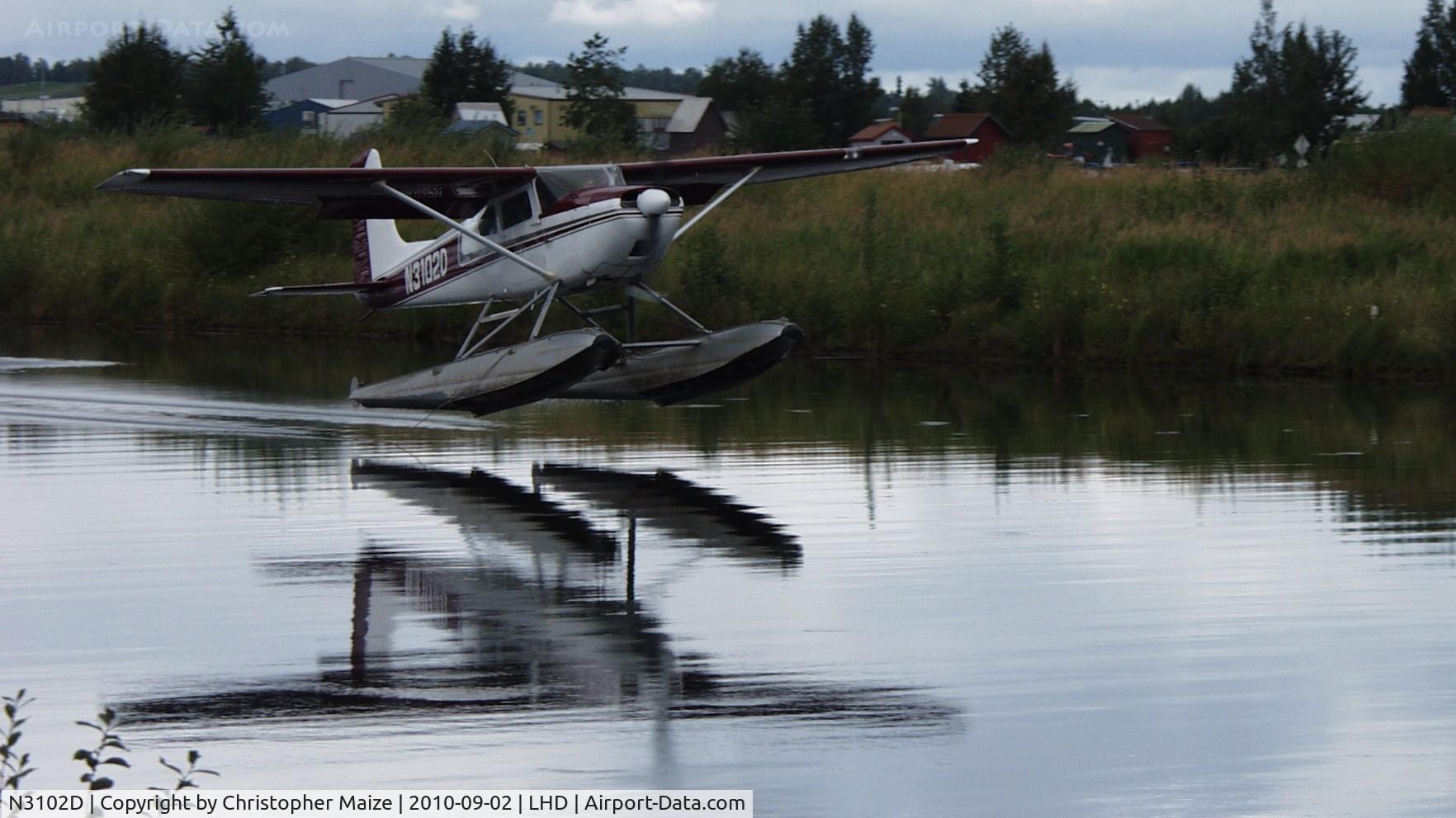 N3102D, 1955 Cessna 180 C/N 31900, Landing East on Lake Hood
