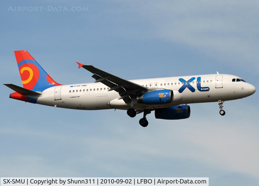 SX-SMU, 1993 Airbus A320-231 C/N 414, Landing rwy 14R with XL titles...