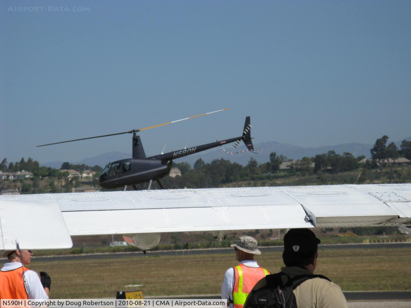 N590H, 2008 Robinson R44 Raven II C/N 12474, 2008 Robinson R44 RAVEN II, Lycoming IO-540-AE1A5 245 Hp for 5 minutes, 205 Hp continuous, quick grab shot, departure