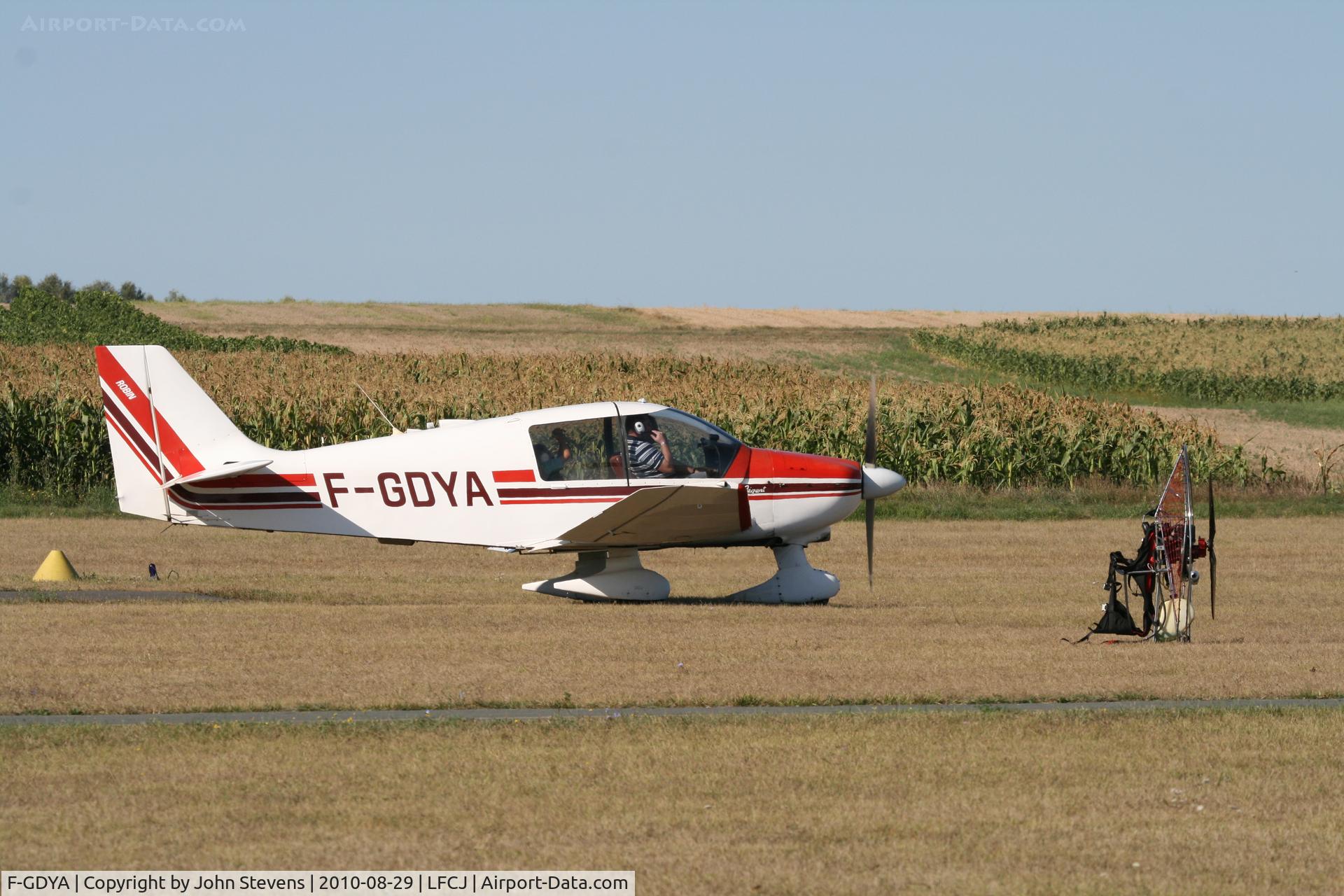 F-GDYA, Robin DR-400-180 Regent C/N 1639, Departing Jonzac (LFCJ). Lots of paramotor activity (note paramotor in foreground of pic).