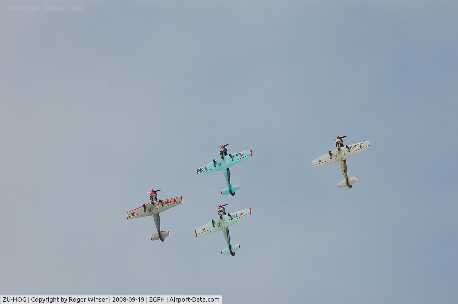 ZU-HOG, 1990 Bacau Yak-52 C/N 9010313, Leading Team Osprey in formation practice.