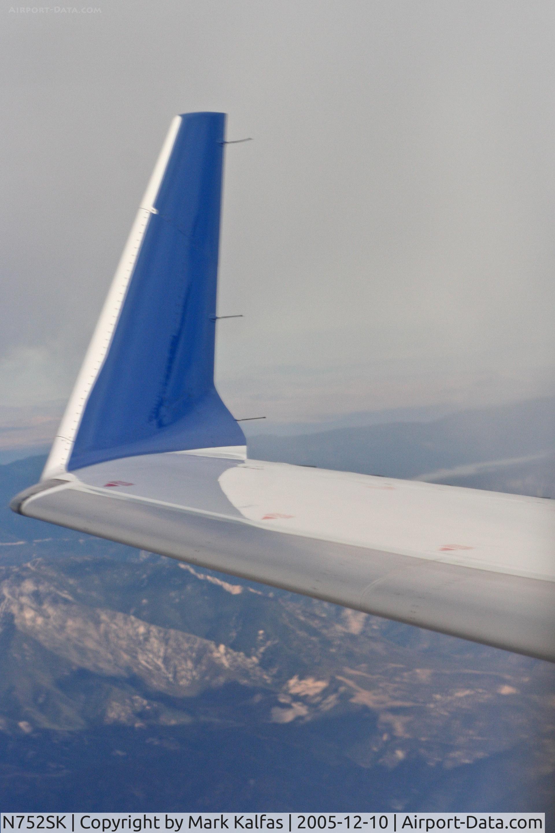 N752SK, 2005 Bombardier CRJ-701ER (CL-600-2C10) Regional Jet C/N 10209, SkyWest Bombardier CL-600-2C10, N752SK inbound to KLAX with the San Bernardino Mountain range in the background on a trip from KTUS.