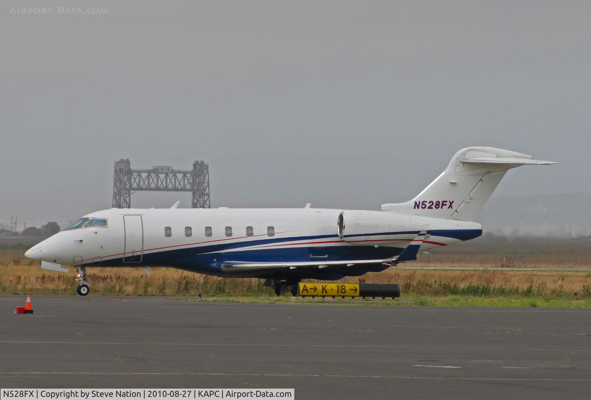 N528FX, 2006 Bombardier Challenger 300 (BD-100-1A10) C/N 20125, Flexjets 2006 BD-100-1A10 arriving from KSJC (San Jose, CA) with Napa River RR Bridge in background