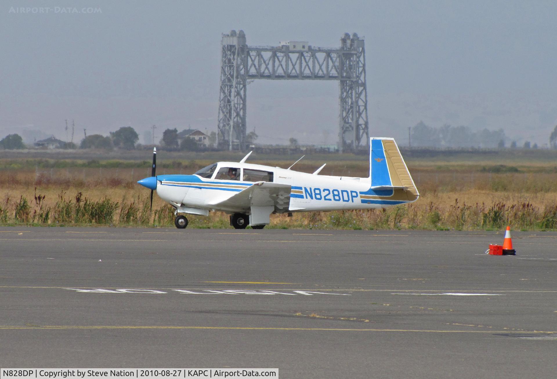 N828DP, 1983 Mooney M20J 201 C/N 24-1348, Locally-based 1983 Mooney M20J taxis past Napa River RR bridge