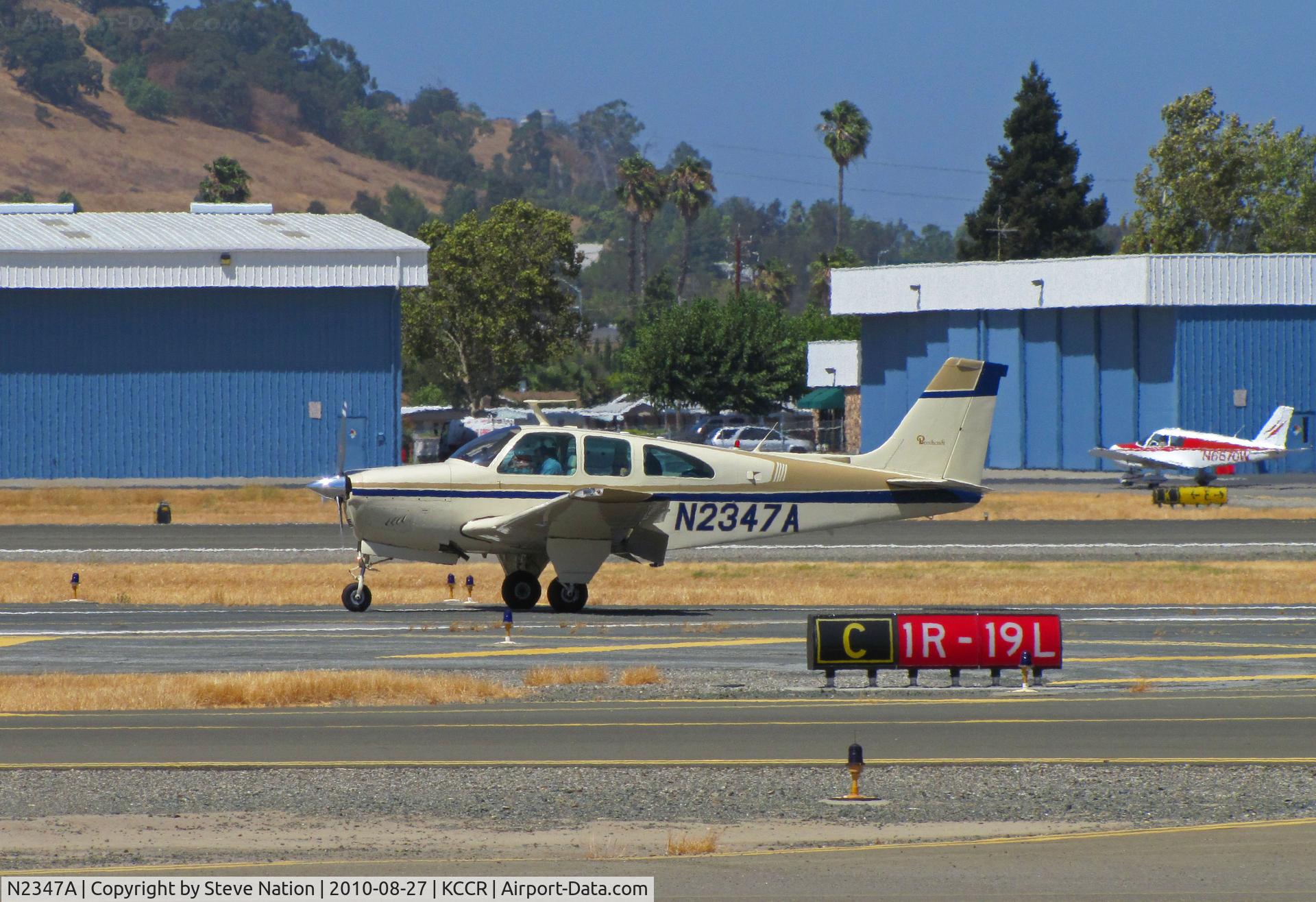 N2347A, 1969 Beech E33 Bonanza C/N CD-1229, Southern California-based 1969 Beech E33 rolling out on RWY19L with flaps down at Buchanan Field