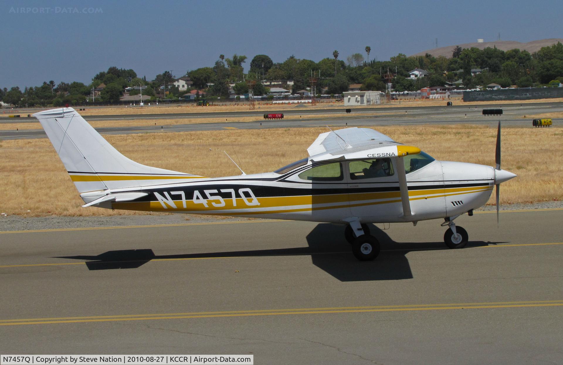N7457Q, 1972 Cessna 182P Skylane C/N 18261097, 1972 Cessna 182P taxis past public viewing area at Buchanan Field