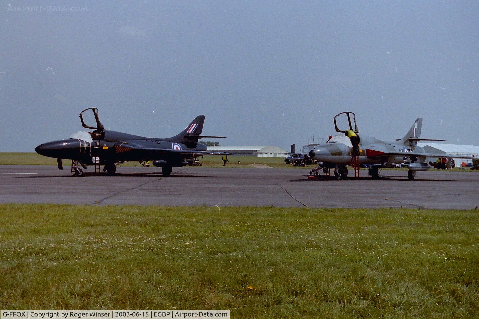 G-FFOX, 1955 Hawker Hunter T.7B C/N 41H-670792, Ex-RAF Hunter T.7A s/n WV318 now coded D in the 'Black Arrows' scheme carried by aircraft of 111 Squadron RAF from 1956 to 1960. Being prepared with Hunter T.7 G-BXFI for the flying display at the Kemble Air Show 2003.