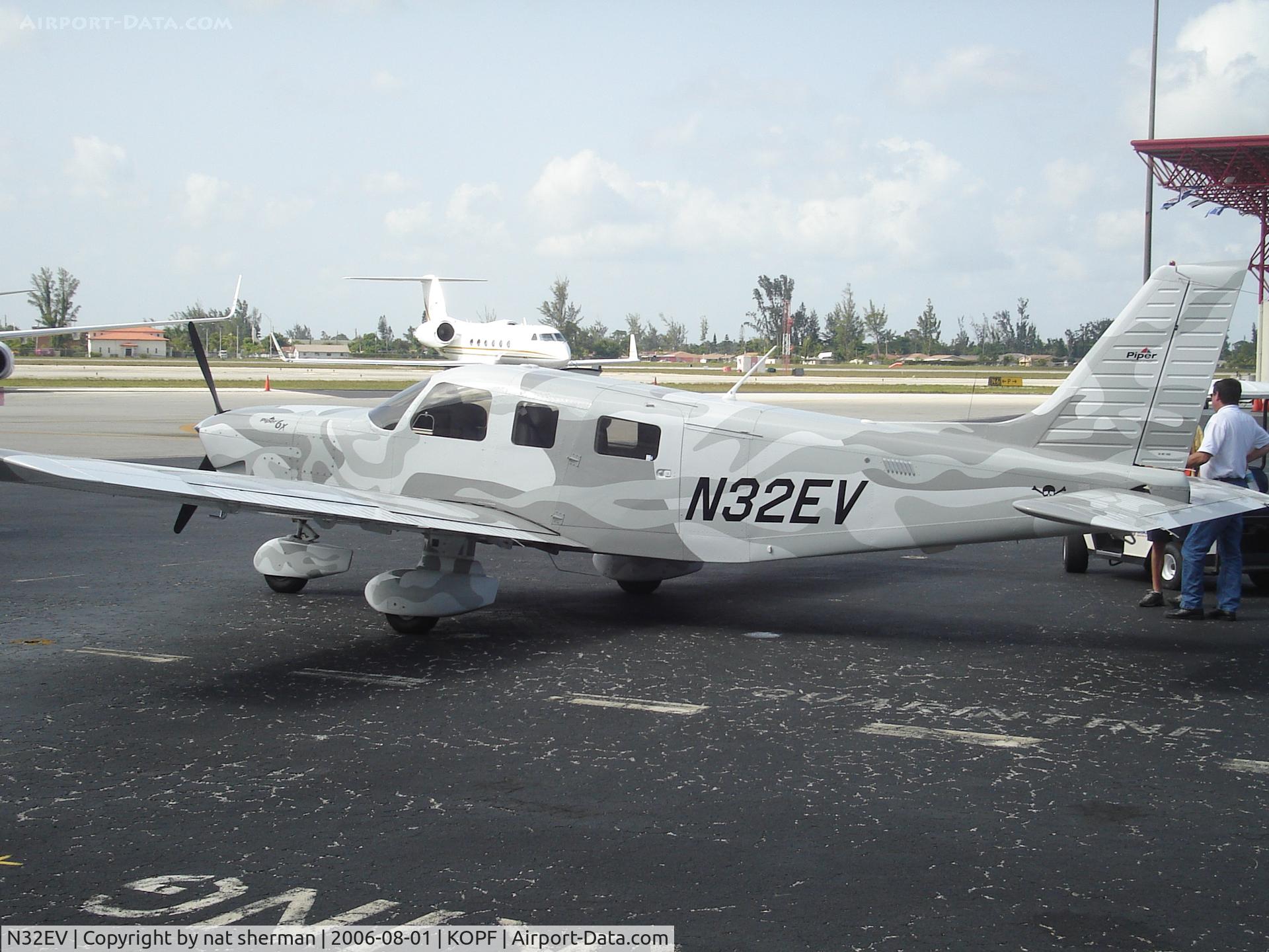 N32EV, 2006 Piper PA-32-301FT Saratoga C/N 3232058, Best paint job I've ever seen. Note the skull and crossbones at the rear fuselage