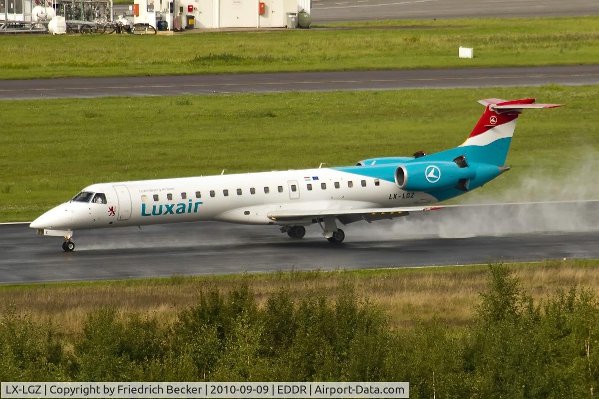 LX-LGZ, 2000 Embraer EMB-145LU (ERJ-145LU) C/N 145258, decelerating with a lot of spume after a downpour