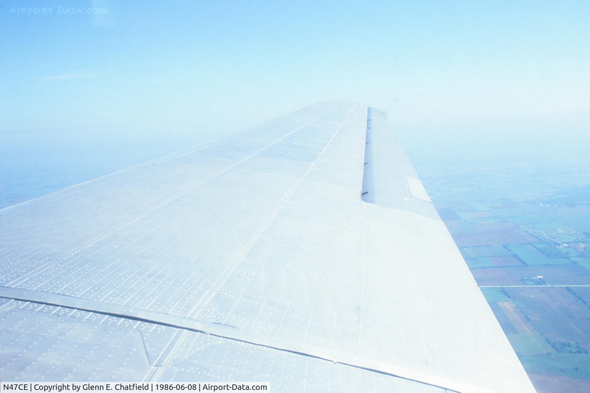 N47CE, 1944 Douglas DC3C-S1C3G (C-47A) C/N 13456, Looking over the right wing somewhere near Rockford, IL