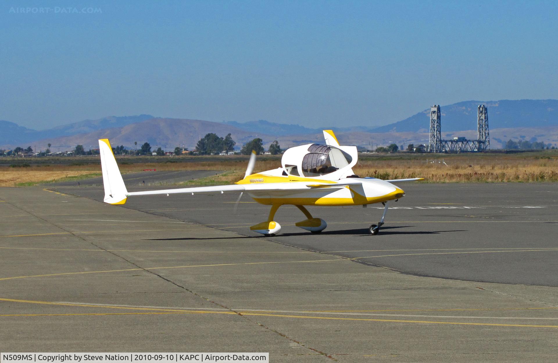 N509MS, 1989 Co-Z Cozy C/N 509, COZY home built from Southern California turning on to transient ramp at Napa, CA (Napa River RR bridge in background))