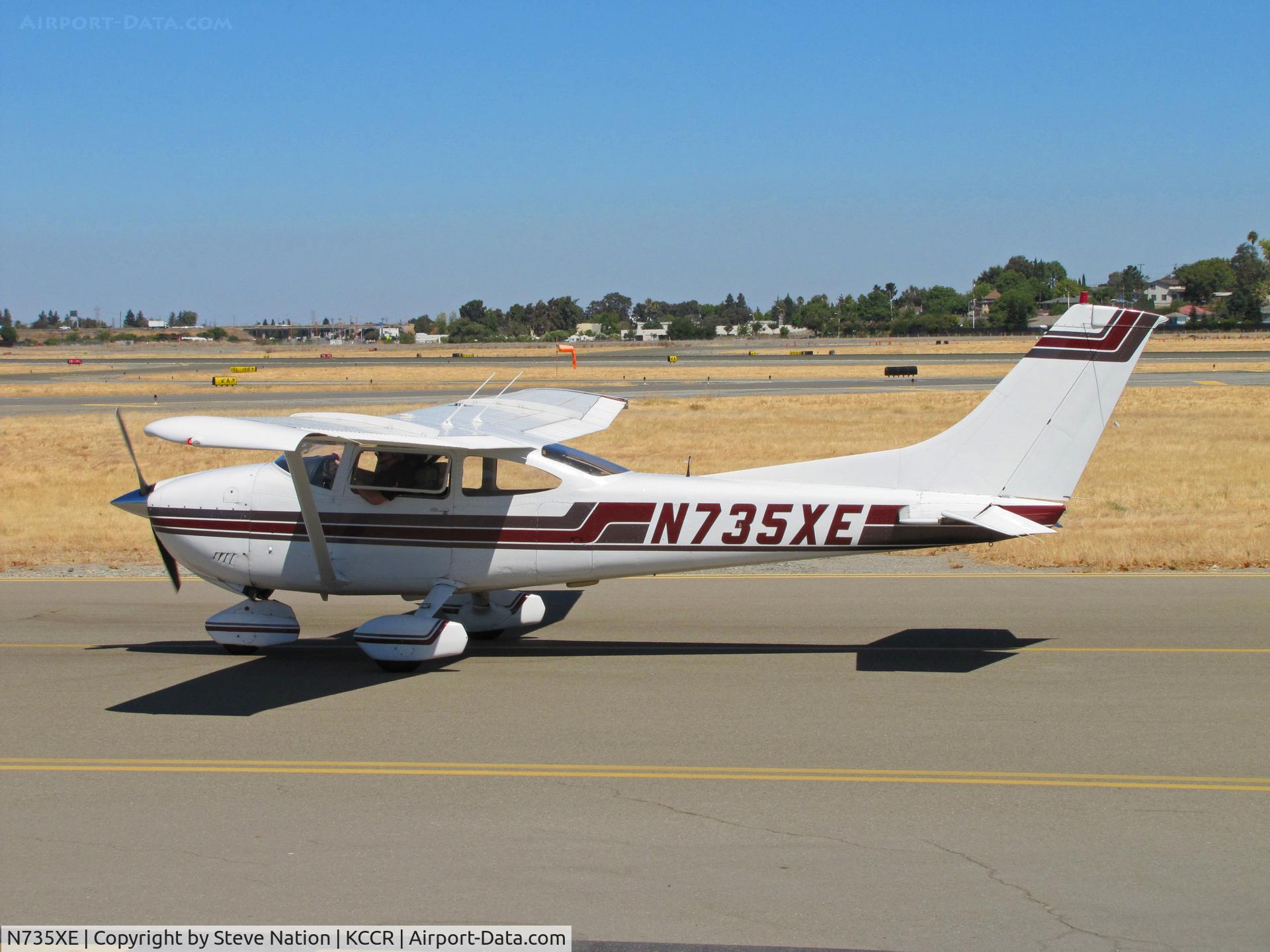 N735XE, 1977 Cessna 182Q Skylane C/N 18265760, Locally-based 1977 Cessna 182Q passing public viewing area on way to RWY1R