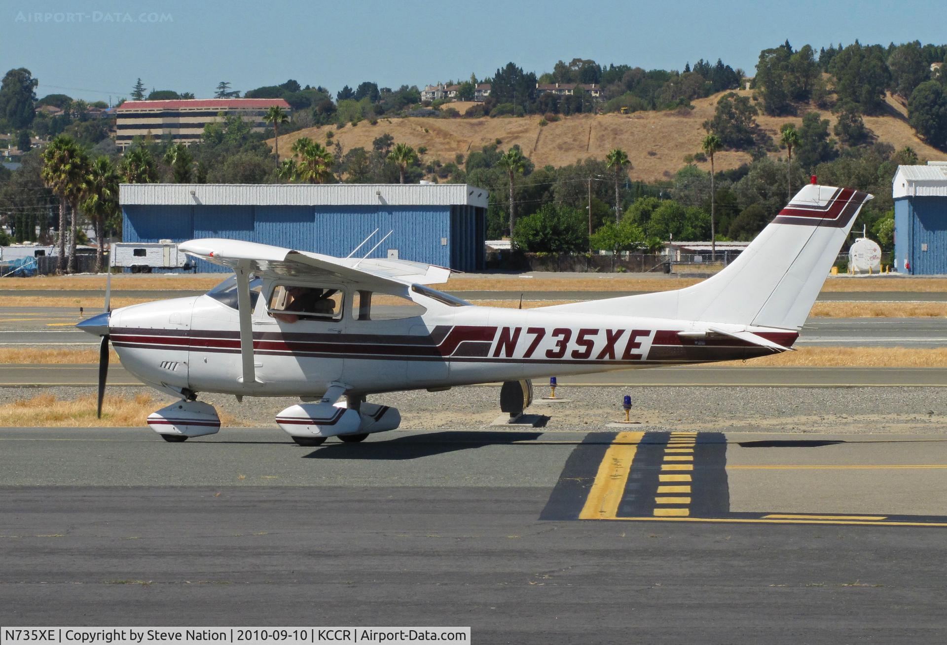 N735XE, 1977 Cessna 182Q Skylane C/N 18265760, Locally-based 1977 Cessna 182Q on way to RWY1R with Concord Jet hangars in background