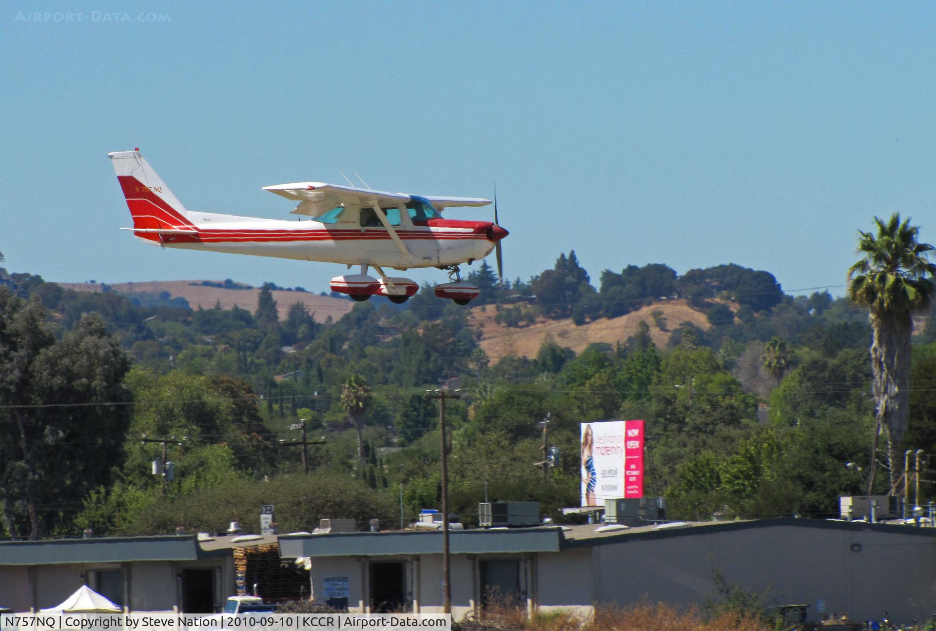 N757NQ, 1977 Cessna 152 C/N 15279876, Pacific States Aviation 1977 Cessna 152 over the fence at Buchanan Field (say, 